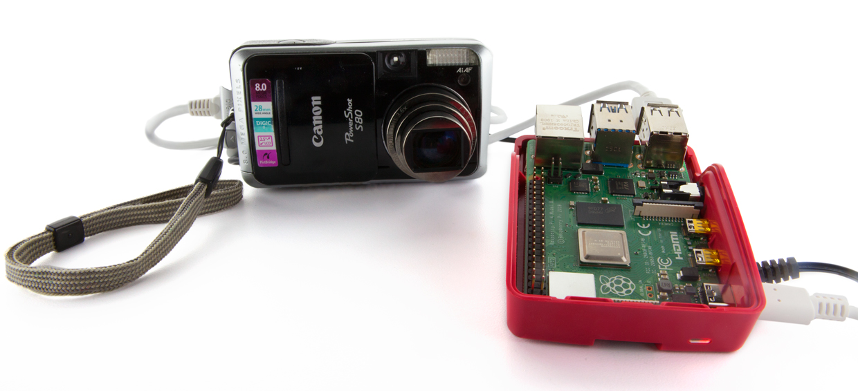 Photo showing a Raspberry Pi and an old digital camera.